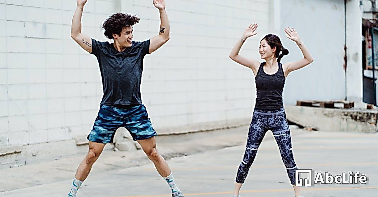 Young Man and Woman Doing Exercise in Yard