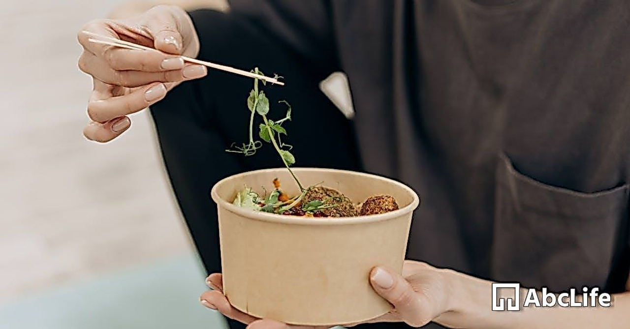 Person Holding A Bowl With Vegetables