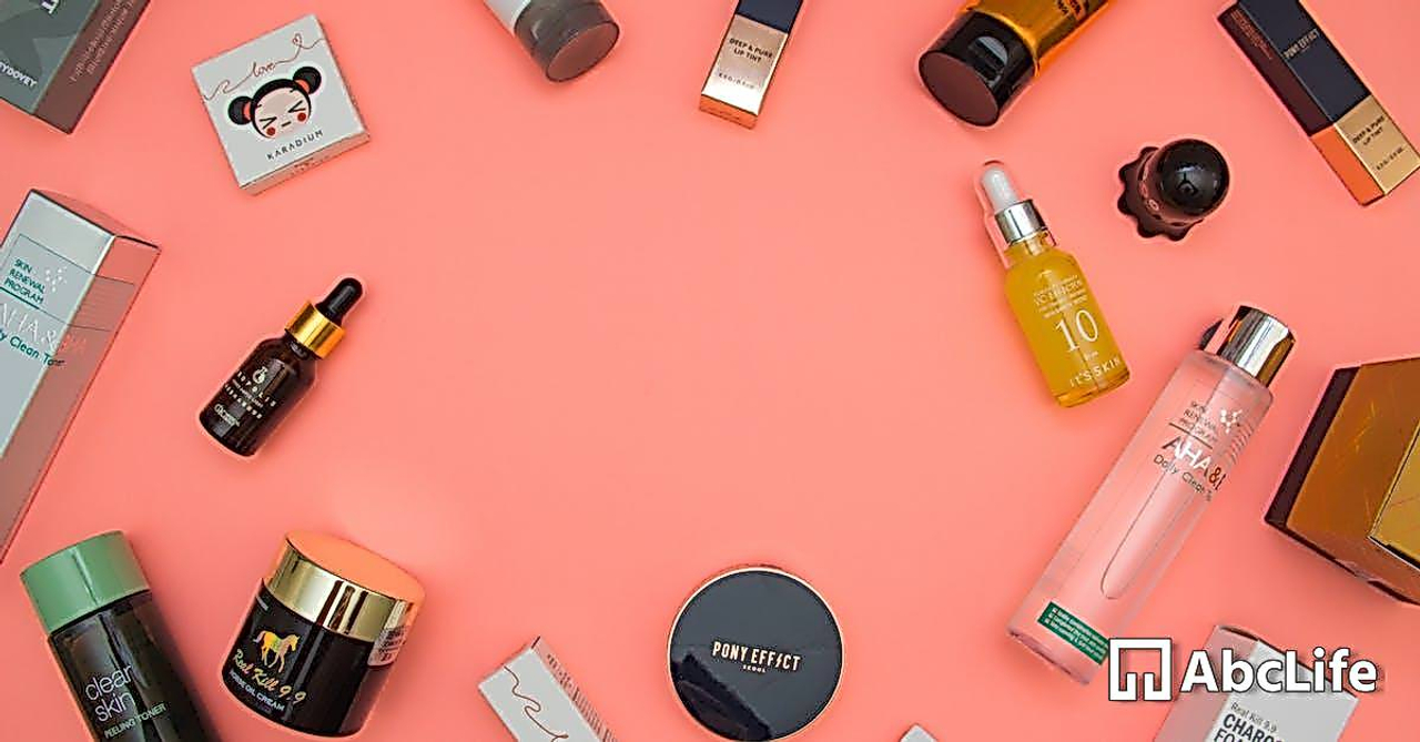 Stylish beauty products arranged on pink table