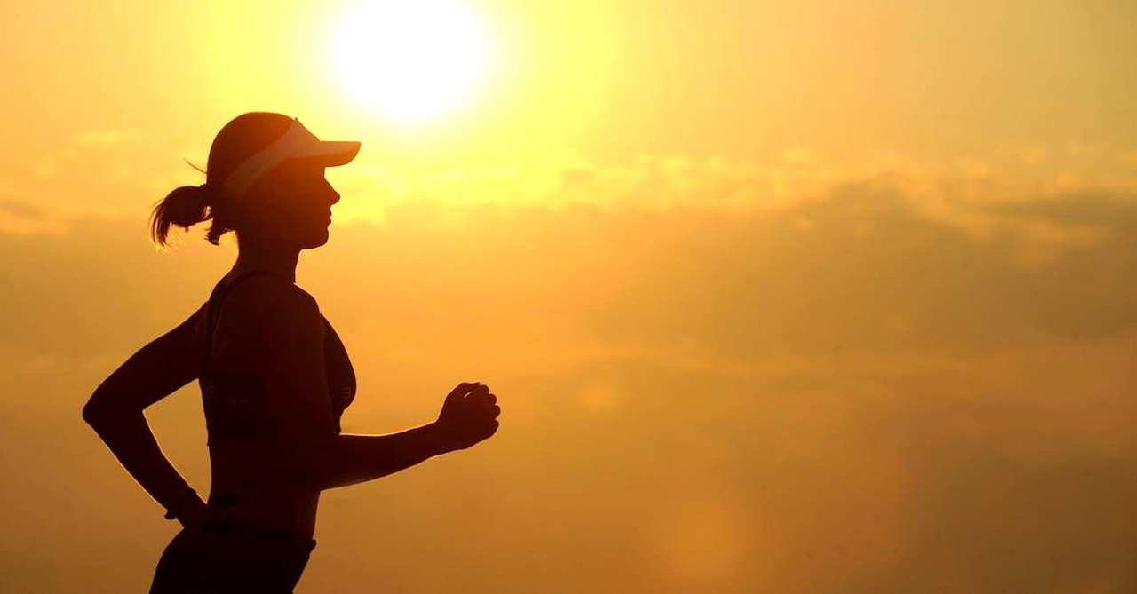 Woman With White Sunvisor Running